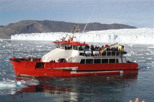 Ship in front of the Eqi glacier