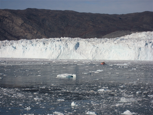A small boat in a big icy world