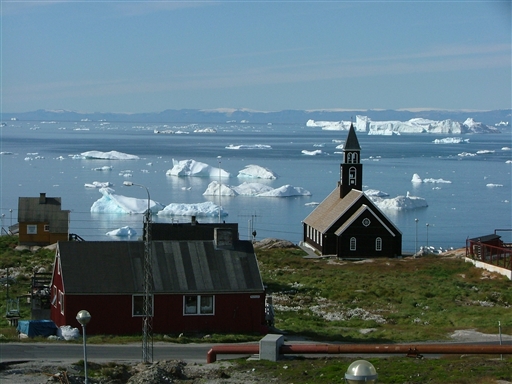 The Zion Church in Ilulissat bordering the Disko Bay - in the background the Disko Island shows itself
