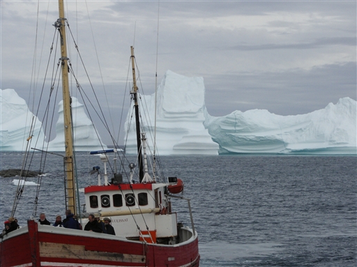 Small boat in a big icy world