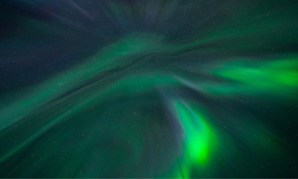 Ilulissat-northernlights-on-snowmobile